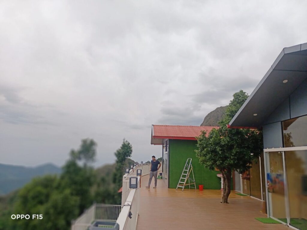 Resort balcony view of lush green hills