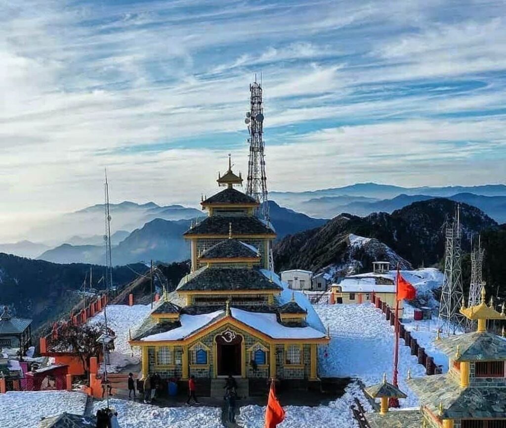Snowy hills with temple in Dhanaulti